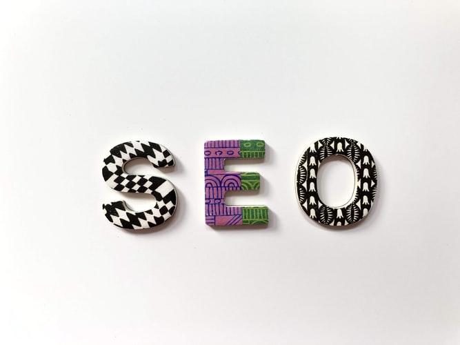 SEO spelled out in colorful letter tiles.