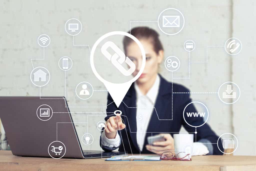 a business woman clicking a button that looks like a hyperlink