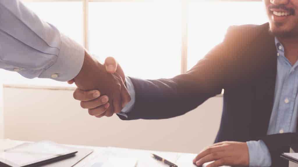 Two business men shaking hands
