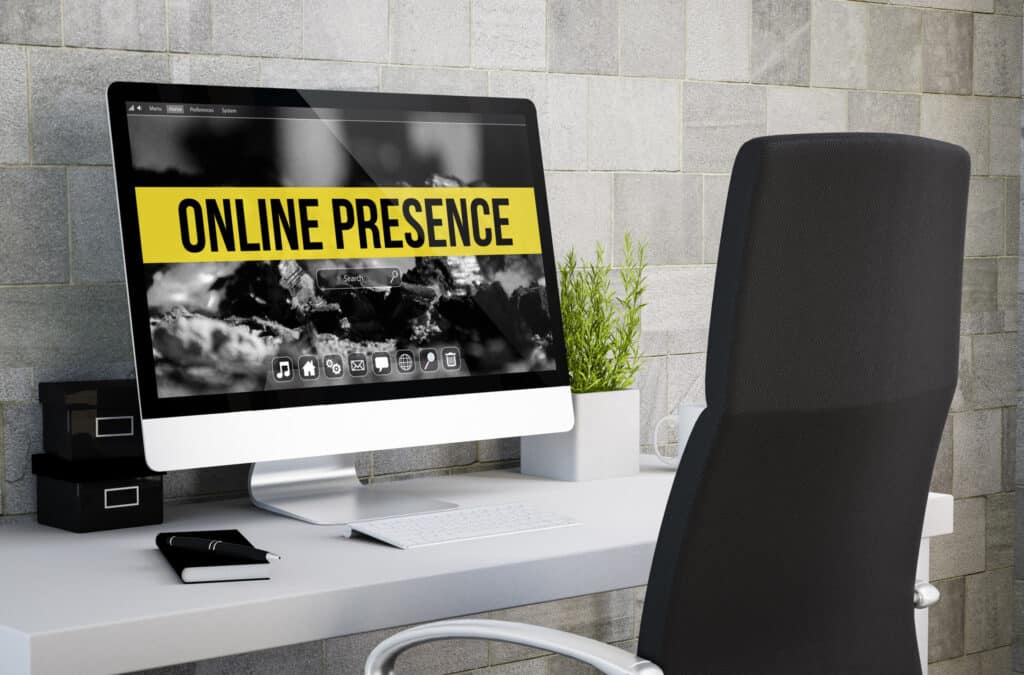 A large desktop computer that reads "online presence" on the screen.