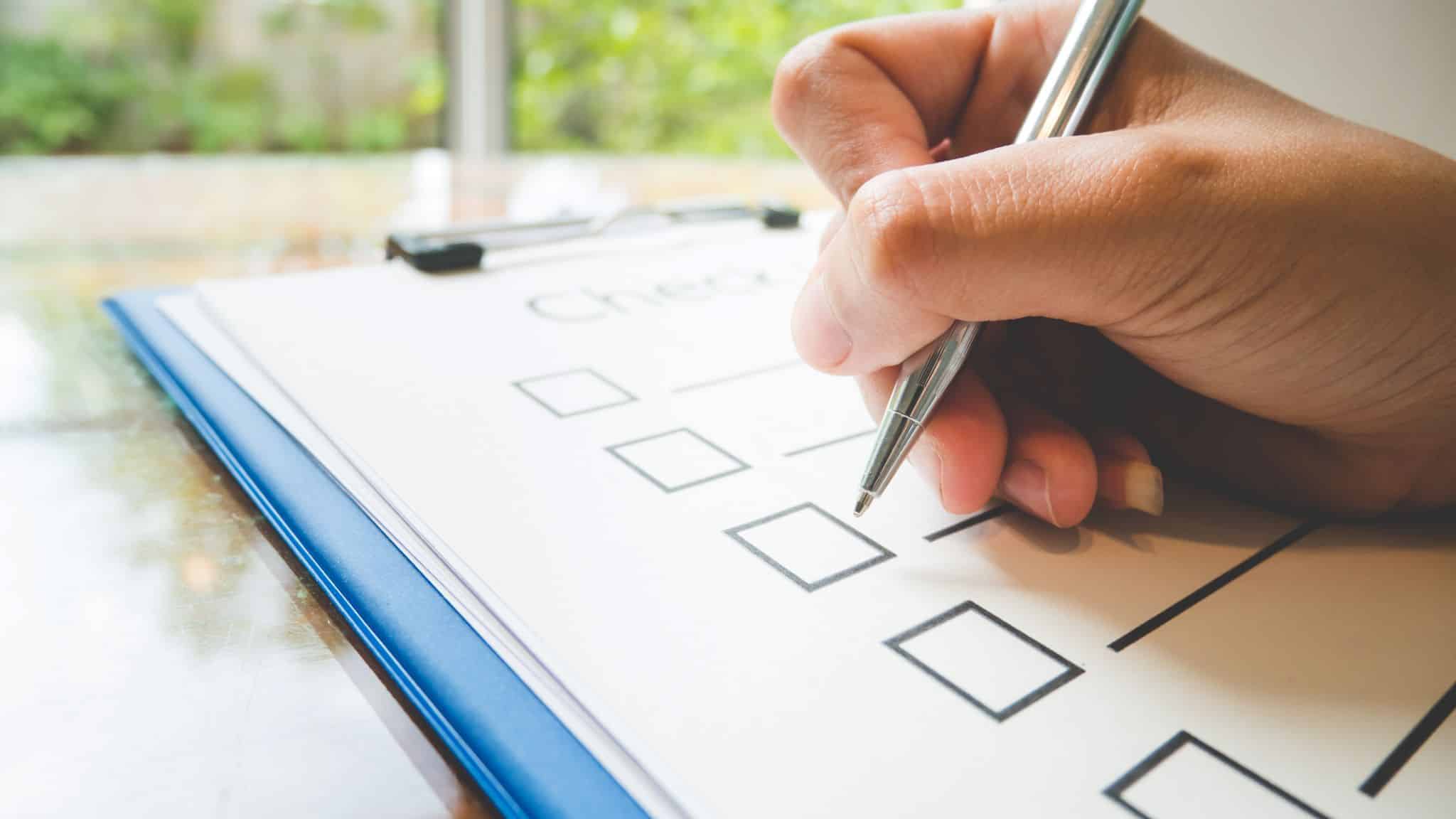 entrepreneur writing in planner